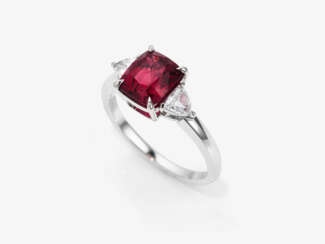A Rivière ring with a red spinel and diamonds