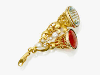 A brooch / hatpin with a topaz, probably fire opal and cultured pearls