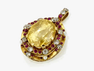 A pendant with yellow sapphire, diamonds, pearls and rubies