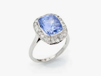 A historical entourage ring decorated with a sapphire and diamonds