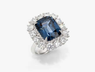 A ring with a blue spinel and brilliant cut diamonds