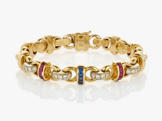 A bracelet with brilliant cut diamonds, rubies and sapphires - фото 1