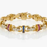 A bracelet with brilliant cut diamonds, rubies and sapphires - фото 1