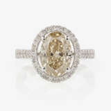 A classic modern cocktail ring decorated with an oval diamond and brilliant cut diamonds - фото 2