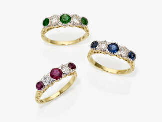Three Rivière rings with brilliant cut diamonds, rubies, emeralds and sapphires