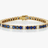 A bracelet with sapphires and brilliant cut diamonds - фото 1