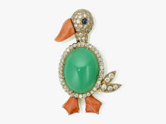 A brooch in the shape of a stylized duck decorated with a chrysoprase, a sapphire and corals