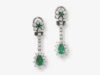 A pair of drop earrings with emeralds and brilliant cut diamonds