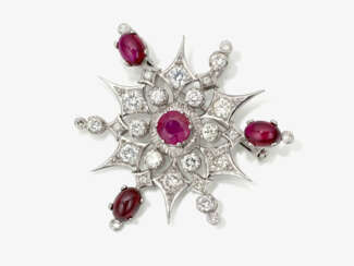 A star pendant decorated with brilliant cut diamonds and rubies