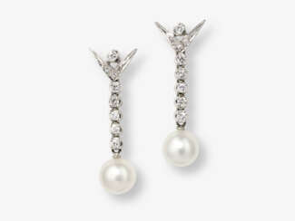 A pair of stud earrings with screw nuts decorated with brilliant cut diamonds and cultured pearls