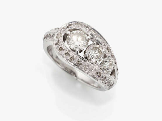 A modified band ring decorated with brilliant cut diamonds - photo 1