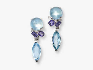 A pair of stud earrings decorated with aquamarines, iolites and brilliant cut diamonds