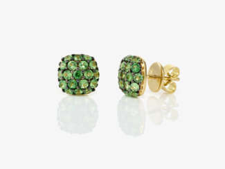 A pair of stud earrings decorated with tsavorites
