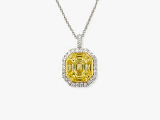 A pendant necklace decorated with intense yellow sapphires and brilliant cut diamonds
