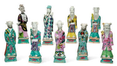 A GROUP OF NINE CHINESE EXPORT PORCELAIN FAMILLE ROSE FIGURES OF IMMORTALS