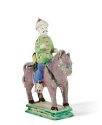A CHINESE EXPORT PORCELAIN FAMILLE ROSE BISCUIT EQUESTRIAN FIGURE