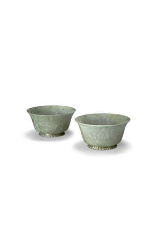 A PAIR OF CHINESE CARVED MUGHAL-STYLE GREENISH-WHITE JADE BOWLS - photo 1