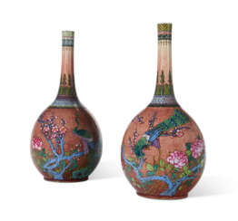 A PAIR OF CHINESE PALE-COPPER-RED-GLAZED AND ENAMELED 'PEACH BLOSSOM' BOTTLE VASES