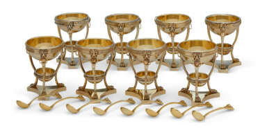 A SET OF EIGHT AMERICAN SILVER-GILT DOUBLE SALT CELLARS AND EIGHT MATCHING SALT SPOONS