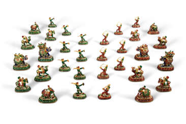 A COMPLETE SET OF GEM-SET GILT AND ENAMELED CHESS PIECES