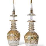 A PAIR OF BOHEMIAN POLYCHROME-PAINTED CUT-GLASS DECANTERS AND TWO STOPPERS - фото 1