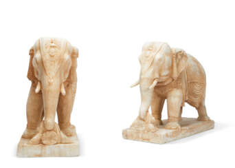 A PAIR OF FINELY CARVED WHITE MARBLE ELEPHANTS