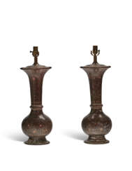 A PAIR OF ENAMEL BRASS VASES, NOW MOUNTED AS LAMPS