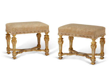 A PAIR OF SOUTH GERMAN WHITE-PAINTED AND PARCEL-GILT STOOLS