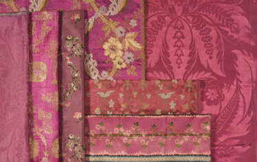 A GROUP OF SEVEN BERRY TONED SILKS