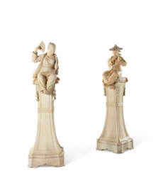A PAIR OF TERRACOTTA CHINOISERIE FIGURES ON PEDESTALS