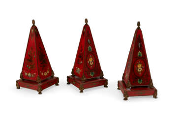 A SET OF THREE FRENCH TOLE-PEINTE AND PARCEL-GILT OBELISK FORM ORNAMENTS