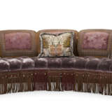A BUTTON-TUFTED LILAC GROUND CURVED FIVE-SEAT SOFA - photo 1