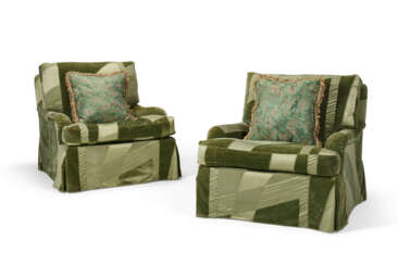 A PAIR OF UPHOLSTERED CLUB CHAIRS