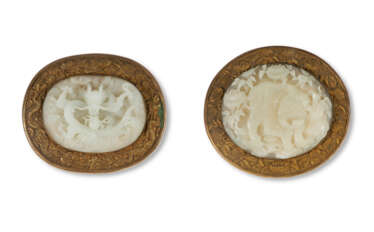 TWO FINELY CARVED CHINESE WHITE JADE PLAQUES IN GILT-METAL MOUNTS
