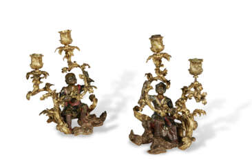 A PAIR OF FRENCH ORMOLU AND LACQUERED-BRONZE TWO-LIGHT CANDELABRA