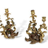 A PAIR OF FRENCH ORMOLU AND LACQUERED-BRONZE TWO-LIGHT CANDELABRA - photo 1
