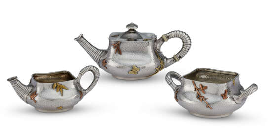 AN AMERICAN SILVER AND MIXED METAL THREE-PIECE `BACHELOR` TEA SERVICE - фото 1