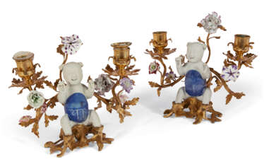 A PAIR OF LOUIS XV ORMOLU-MOUNTED CHINESE AND FRENCH PORCELAIN TWIN-BRANCH CANDELABRA