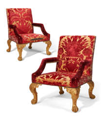 A PAIR OF GEORGE II STYLE GILTWOOD ARMCHAIRS