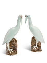 A PAIR OF CHINESE EXPORT PORCELAIN PALE CELADON MODELS OF CRANES