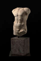 A GREEK MARBLE TORSO OF AN ATHLETE