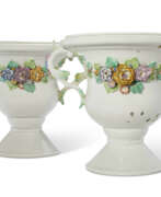 Chantilly Porcelain Factory. A PAIR OF CHANTILLY PORCELAIN FLOWER-ENCRUSTED VASES ON PEDESTAL FEET