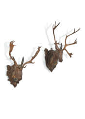 TWO GERMAN 'BLACK FOREST' TINTED PLASTER, STAINED WOOD AND ANTLER TROPHIES