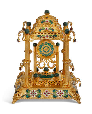 A CONTINENTAL GEM AND HARDSTONE-MOUNTED SILVER-GILT AND ENAMEL MUSICAL MANTEL CLOCK - photo 1
