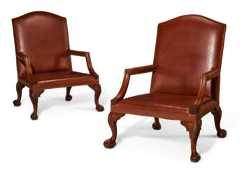 A PAIR OF GEORGE II MAHOGANY LIBRARY ARMCHAIRS