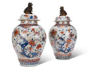 A PAIR OF CHINESE IMARI PORCELAIN VASES AND COVERS
