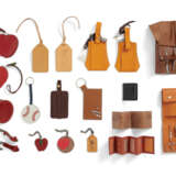 A GROUP OF TWENTY ONE: A GROUP OF TWO SANDAL CHARMS, A GROUP OF THREE LARGE FRUIT COIN PURSES, A SMALL FRUIT CHARM, A ROUND HEART CHARM, A 'MERCI' CHARM, A GROUP OF TWO LEATHER TAGS, A GROUP OF THREE PICTURE BOOKLETS, A BASEBALL CHARM, A GROUP OF TWO ORAN - photo 1