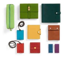 A GROUP OF TEN: A VERT OLIVE LEATHER NOTEBOOK WITH KELLY CLOSURE, A VERT FONCE LEATHER NOTEBOOK WITH ADDRESS BOX, ONE STATIONARY GROUP, A GROUP OF TWO LEATHER NOTEBOOK NECKLACES, A PENCIL CASE, A GROUP OF TWO KLIPDOC, A SMALL AGENDA COVER, AND A POST IT N