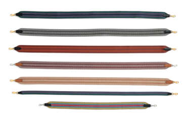 A GROUP OF SEVEN CANVAS SHOULDER STRAPS