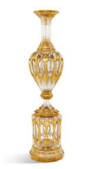 A LARGE BOHEMIAN GILT-DECORATED CLEAR GLASS VASE ON STAND